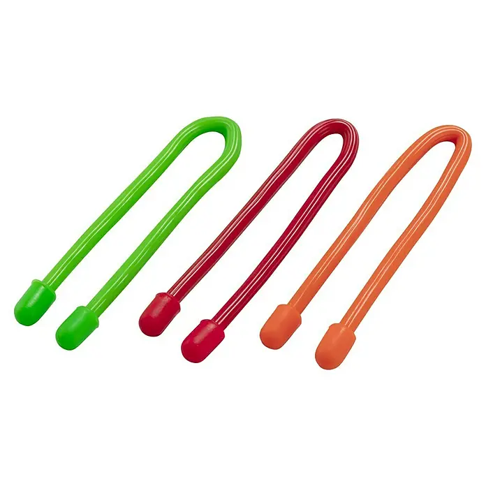 Inofix Bridas para cables Magic Tie - 3 ud., 15 cm, Multicolor - Primer plano de tres bridas flexibles de colores en verde, rojo y naranja, perfectas para organizar cables y otros objetos.