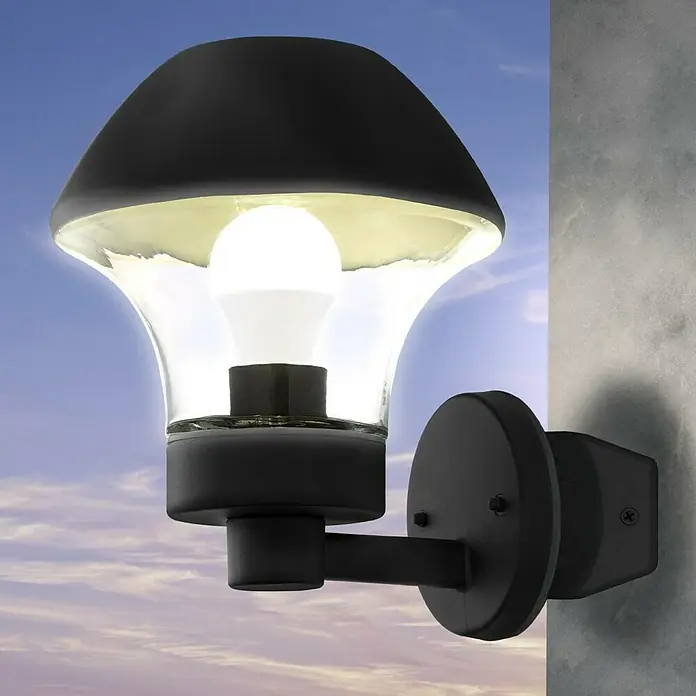 Starlux Eckanbindung - Durchmesser: 12 cm, Schwarz - Nahaufnahme einer modernen schwarzen Außenwandleuchte mit klarem Glasschirm und einer hellen Glühbirne.