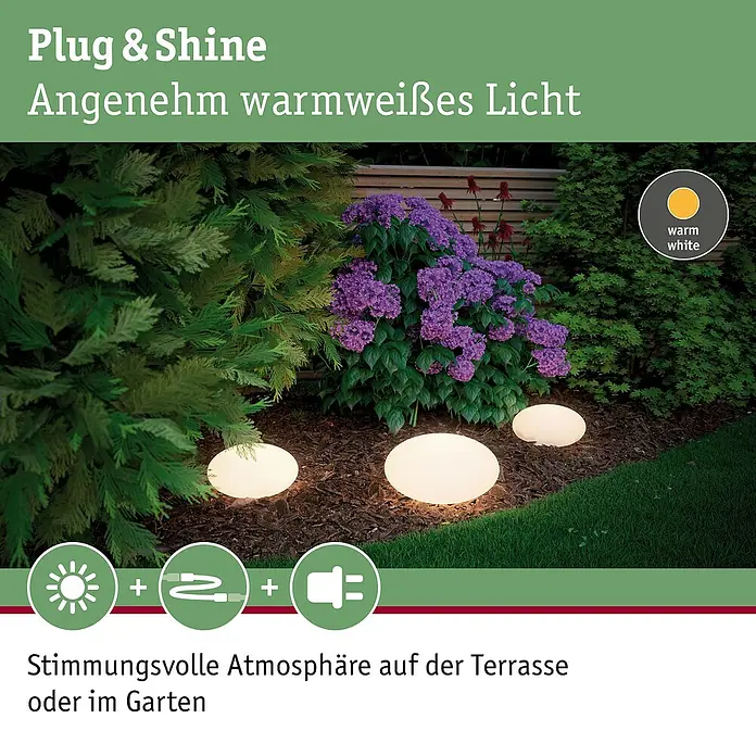 Paulmann Plug & Shine LED-Dekoleuchte Stone - 2,8 W, Weiß, L x B x H: 28 x 28 x 16,6 cm - Bild von drei Plug & Shine-Gartenleuchten, die warmweißes Licht ausstrahlen und eine stimmungsvolle Atmosphäre erzeugen.
