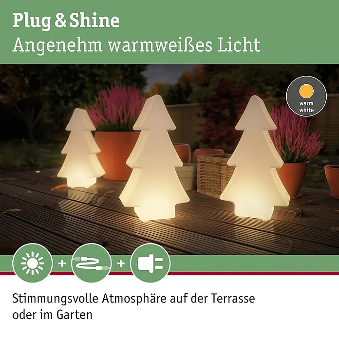 Paulmann Plug & Shine LED-Dekoleuchte Tree - Weiß, L x B x H: 14 cm x 28 mm x 49 cm - Das Bild zeigt die Plug & Shine Weihnachtsbaum-Leuchte, die warmweißes Licht spendet und eine stimmungsvolle Atmosphäre auf der Terrasse oder im Garten erzeugt.