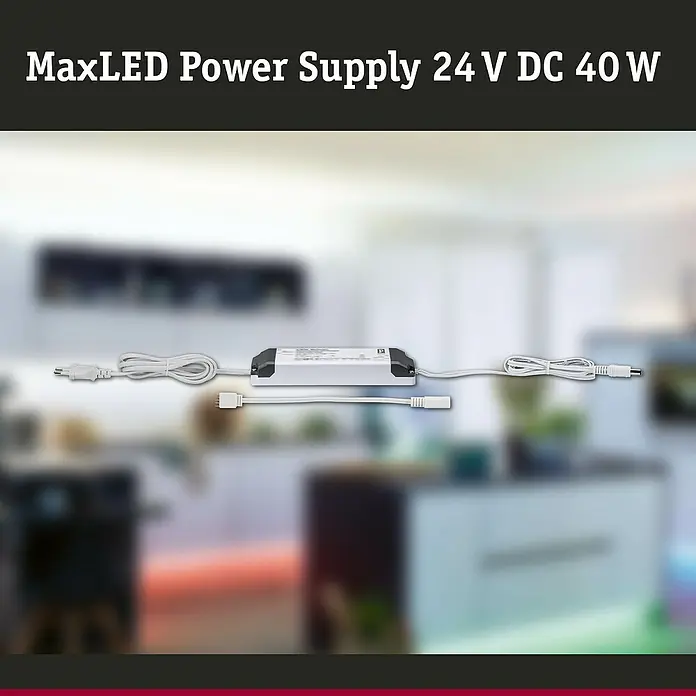 Paulmann MaxLED Stromeinspeisung Power Supply 40VA DC - B x H: 52 x 24 mm, Weiß - Produktbild eines MaxLED Power Supply 24 V DC 40 W Netzteils mit Kabeln und Steckern, geeignet für LED-Beleuchtungssysteme.