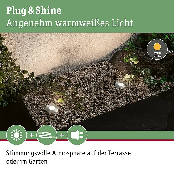 Paulmann Plug & Shine LED-Gartenspot Floor Mini - 2,5 W, 24 V, IP65 - Das Bild zeigt drei Plug & Shine warmweiße Bodenleuchten, die in einem Garten installiert sind, mit Kies und Pflanzen.