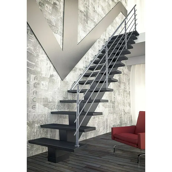 Sogem Escalera principal Gomera con barandilla - Valchromat® acabado óleo, Ancho: 85 cm, Recto, Altura de planta: 285,2 cm - Elegante escalera voladiza con barandilla de acero inoxidable contra una pared gris estampada, junto a un sillón rojo sobre piso de madera oscura.