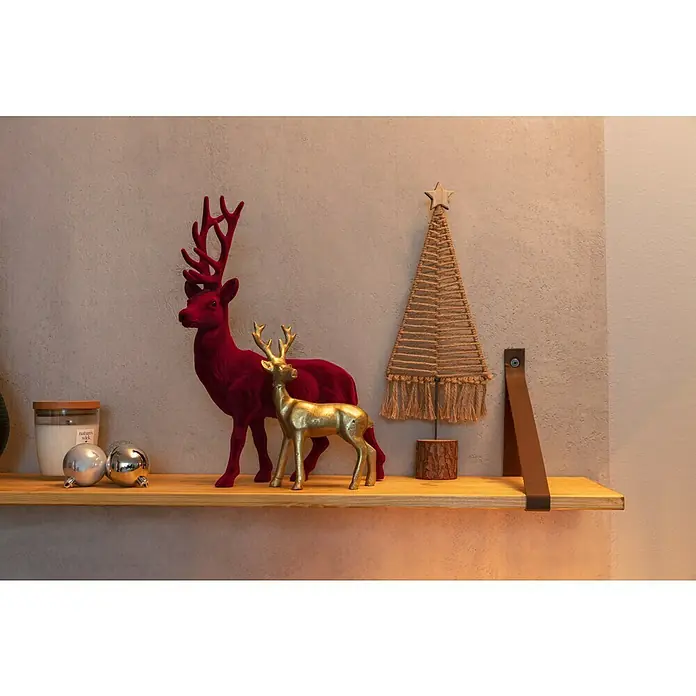 Woodwick Nature's Wick Duftkerze - Im Glas, Smoked Vanilla, Anzahl Dochte: 1 Stk. - Festliche Weihnachtsdekoration mit roten und goldenen Hirschen, Kugeln und einem dekorativen Weihnachtsbaum auf einem Holzregal.