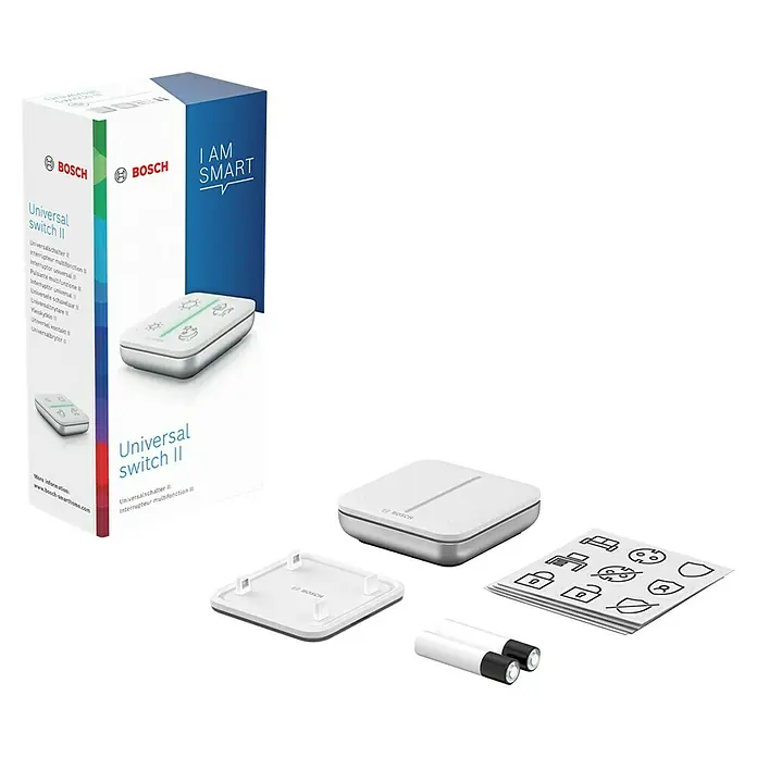 Bosch Smart Home Universalschalter II - Batteriebetrieben - Das Bild zeigt eine Bosch Universal Switch II Verpackung mit dem Produkt, einer Abdeckung, Batterien und Aufklebern.