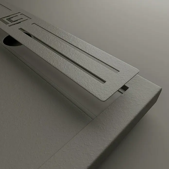 GME Rejilla de desagüe para plato de ducha Style Plus - Acero inoxidable, Gris, Específico para: Platos de ducha de An: 70 cm - Primer plano de un diseño moderno gris que muestra una placa metálica con ranuras sobre una base a juego.
