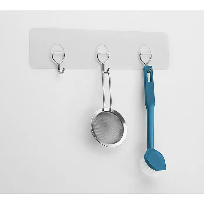 Inofix Gancho para colgar 1293 - L x An x Al: 290 x 81 x 22 mm, Número de ganchos: 3 ud. - Utensilios de cocina colgados en un soporte de ganchos autoadhesivo: un tamiz y un cepillo, prácticos para la organización de la cocina.