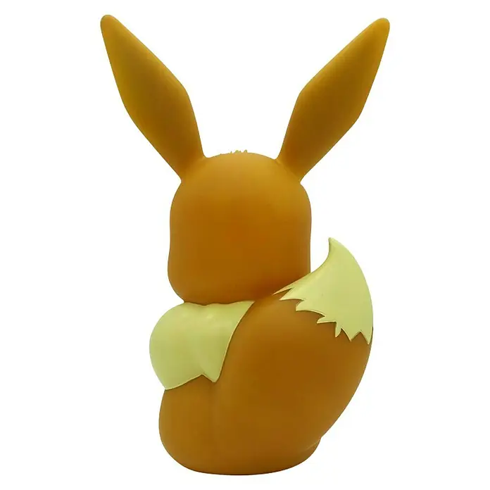 Lámpara LED decorativa Eevee - L x An x Al: 21,5 x 14,5 x 32,5 cm - Vista posterior de una figura de Eevee, que muestra su cola tupida y sus largas orejas. La figura es imprescindible para cualquier fan de Pokémon.