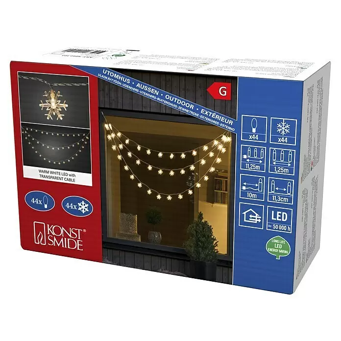 Konstsmide LED-Lichtervorhang - Außen, 1,25 m, Warmweiß, 44 Stk., Netzbetrieben - Verpackung für warmweiße LED-Schneeflocken-Lichterkette mit transparentem Kabel für den Außenbereich.