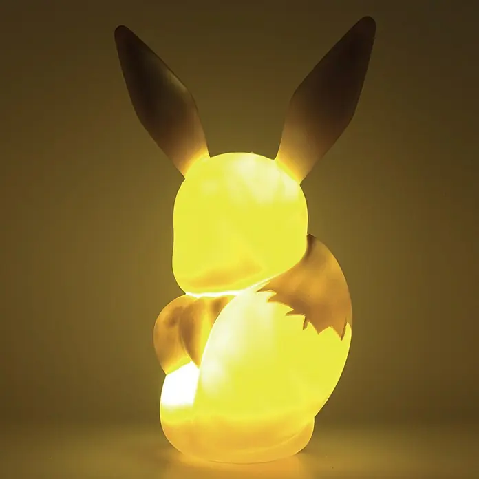 Lámpara LED decorativa Eevee - L x An x Al: 21,5 x 14,5 x 32,5 cm - Figura iluminada de Eevee que actúa como lámpara, emitiendo un cálido brillo amarillo. Perfecto para fans de Pokémon.