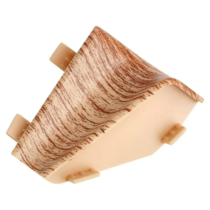 LOGOCLIC Innenecke K40 C - Birke, 2 Stk., Passend für: LOGOCLIC Sockelleiste K40 C - Nahaufnahme einer beigen Ecke mit Holzmaserung und Laschen, die für verschiedene Oberflächen geeignet ist.