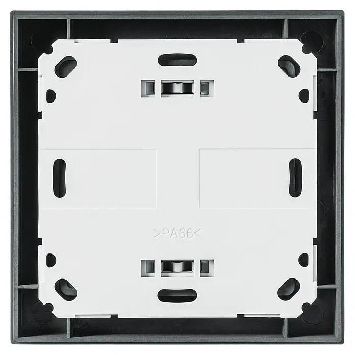 Homematic IP Funk-Wandtaster HmIP-WRC6-A - Batteriebetrieben, Anthrazit, 22 x 86 x 86 mm - Nahaufnahme der Rückseite einer schwarzen SCHUKO-Steckdose, die die internen Komponenten und die Bauweise des Produkts zeigt.