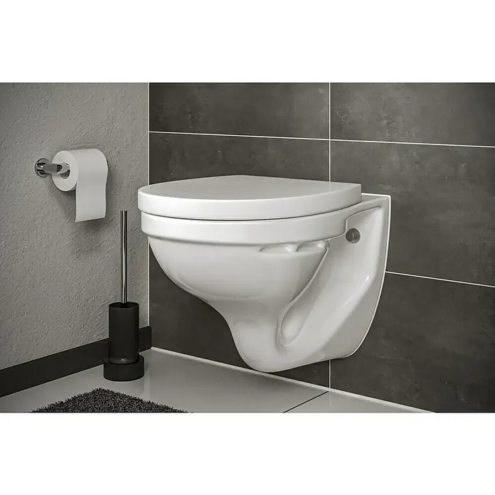 Simena Wand-WC - Mit Spülrand, Ohne Spezialglasur, Spülform: Tief, WC Abgang: Waagerecht, Weiß - Dieses Bild zeigt eine wandhängende Toilette mit Toilettenpapierhalter und Bürste in einem modernen Badezimmer. Die Toilette ist weiß, das Zubehör schwarz.