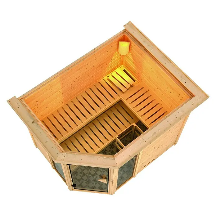 Karibu Massivholzsauna Sinai 3 - Ohne Ofen, Mit Dachkranz und Beleuchtung, L x B x H: 264 x 198 x 200 cm - Luftaufnahme einer Ecksauna aus hellem Holz mit Glasfront und Holzbänken im Inneren.