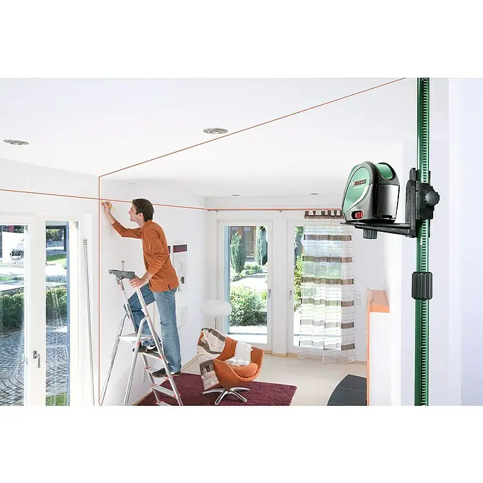 Bosch Teleskopstange TP 320 - Kunststoff, Arbeitshöhe: 10 cm - 320 cm - Das Bild zeigt einen Bosch Kreuzlinienlaser mit Stativ in einem Raum, der zur Ausrichtung für Bauarbeiten dient.