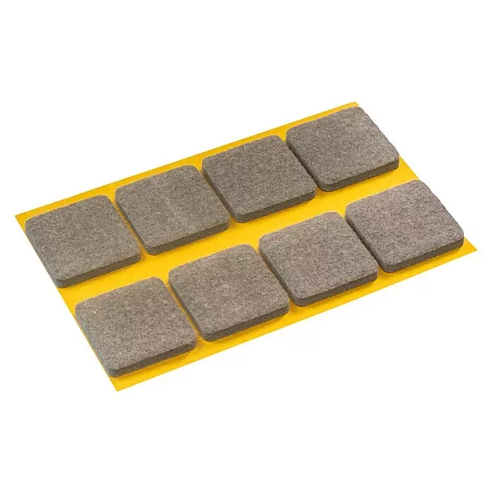 Stabilit Filzgleiter - B x L: 34 x 34 mm, Grau, Kleben, 8 Stk. - Acht graue, quadratische Filzgleiter auf einem gelben Klebestreifen.