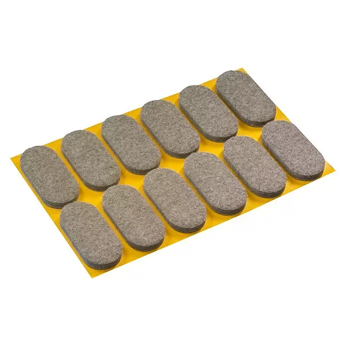 Stabilit Filzgleiter - B x L: 44 x 20 mm, Grau, Kleben, 12 Stk. - Graue, selbstklebende Filzgleiter für Möbel auf gelbem Trägerpapier.