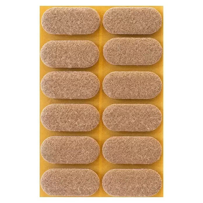 Stabilit Filzgleiter - B x L: 44 x 20 mm, Braun, 12 Stk., Kleben - Mehrere beige Filz-Möbelgleiter für Bodenschutz, auf gelbem Untergrund.