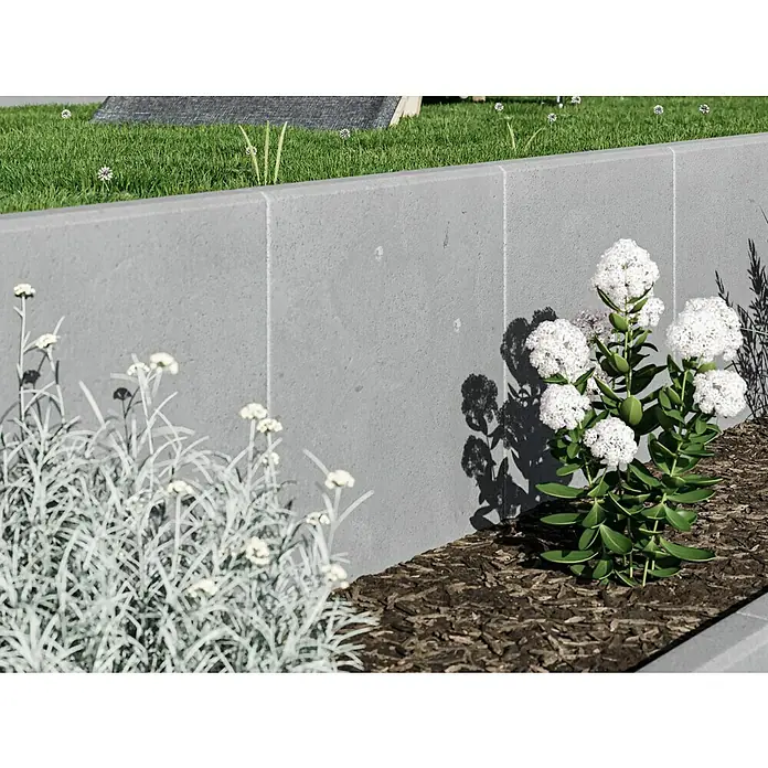 Diephaus L-SteinUnbewehrt, Höhe: 60 cm, Breite: 50 cm, Stärke: 7 cm, Grau - Nahaufnahme eines Gartens mit weißen Blüten und einer grauen Mauer im Hintergrund, die die Schönheit der Pflanzen hervorhebt.