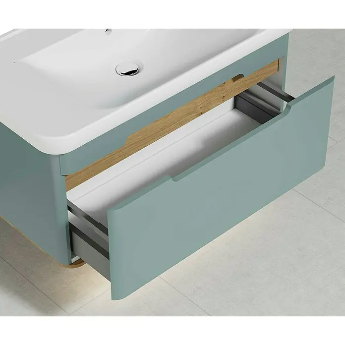 VitrA Sento Badmöbel-Set - 98 cm, Fjordgrün, Griffmulde - Nahaufnahme eines Badezimmerunterschranks mit einer offenen Schublade, die das Design und die Funktionalität hervorhebt.