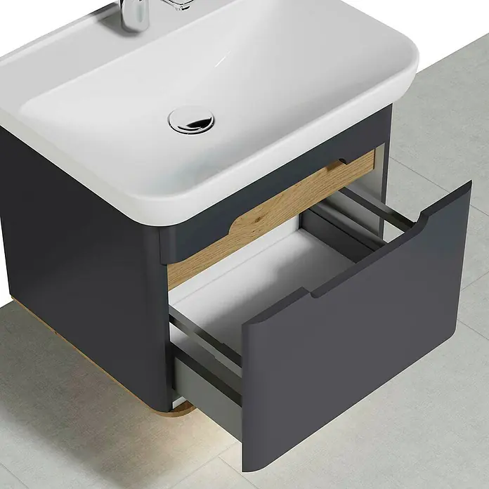VitrA Sento Badmöbel-Set - 54,5 cm, Anthrazit, Griffmulde - Ansicht eines Badezimmerwaschtisches mit einer offenen Schublade, die die Aufbewahrungslösung und das moderne Design des Produkts hervorhebt.