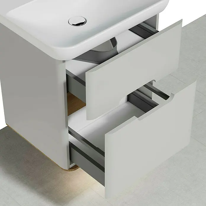VitrA Sento Badmöbel-Set - 63 cm, Hellgrau, 2 Schubladen - Ein Badezimmerschrank mit zwei offenen Schubladen, die das Innere zeigen, mit einer hellgrauen Farbe.