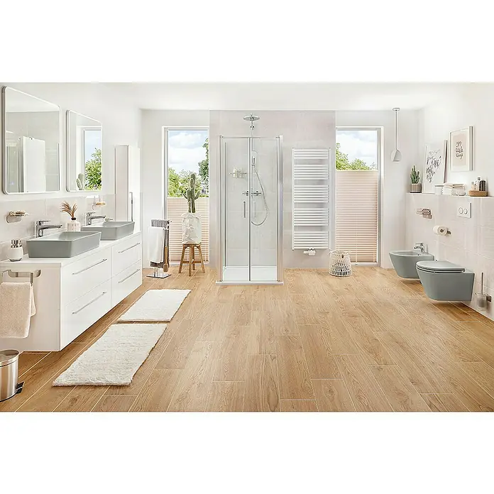 RAK Ceramics Feeling Wand-Bidet - 36 x 52 cm, Grau, Keramik, Ohne Spezialglasur - Ein helles Badezimmer mit hellen Holzfußboden, zwei Waschbecken und einer Duschkabine. Die grauen Waschbecken sind stilvoll und modern.