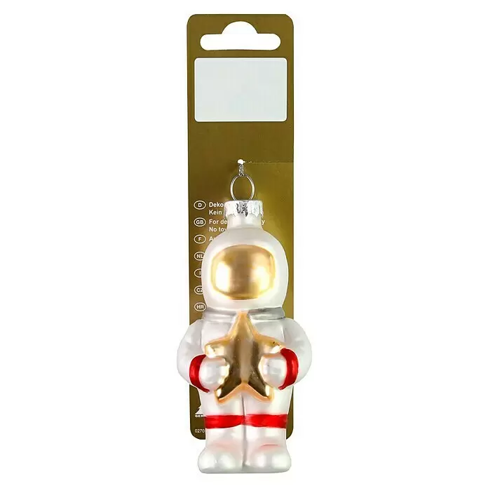 Christbaumschmuck Astronaut - Glas, 5,3 x 3,5 x 8,5 cm - Weißer Astronauten-Glasanhänger mit goldenem Stern, goldfarbenem Visier und roten Details, auf goldener Verkaufspackung.