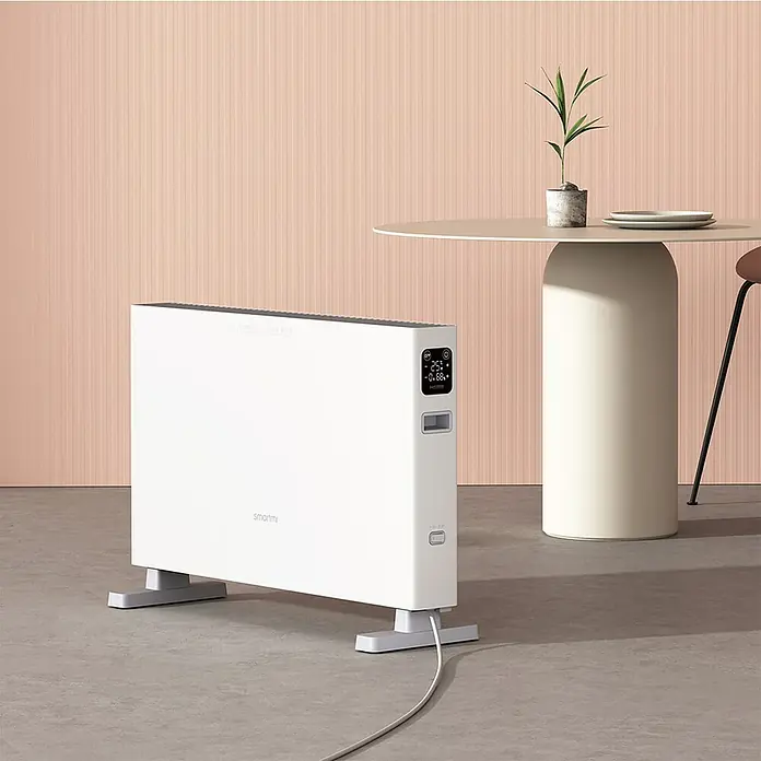 Xiaomi Convector Smartmi 1S - 2.200 W, 20,2 x 69,4 x 44,8 cm - Un radiador Smartmi blanco y elegante con pantalla digital sobre un suelo gris, que ofrece calidez y estilo modernos.