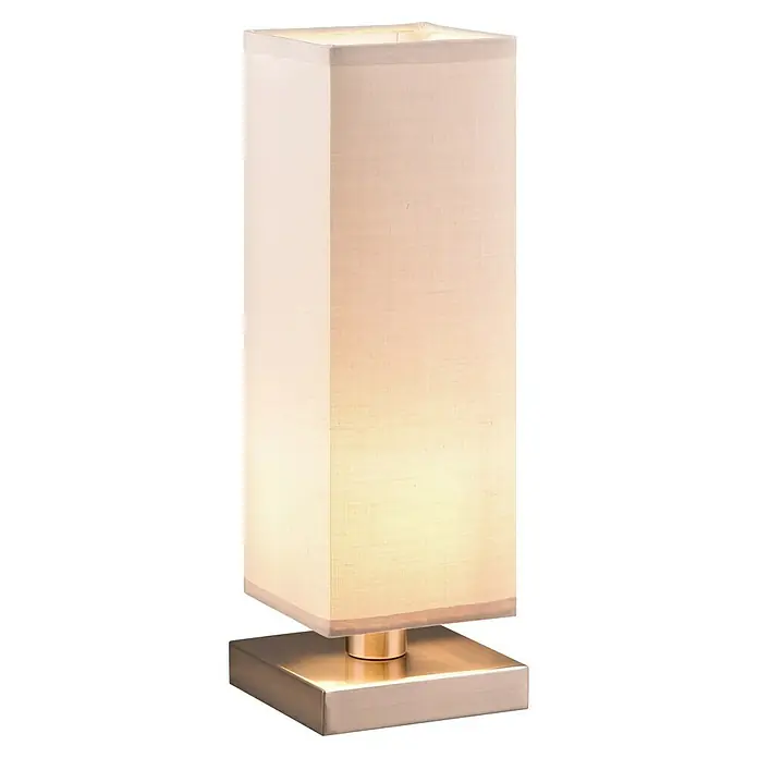 Lámpara de sobremesa decorativa Touch - 60 W, L x An x Al: 12 x 12 x 35,5 cm, Níquel satinado, Gris, E14 - Primer plano de una lámpara de mesa cuadrada iluminada con pantalla beige y base metálica, que desprende un ambiente cálido.