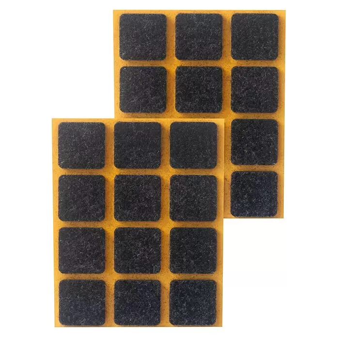 Stabilit Filzgleiter - B x L: 25 x 25 mm, Schwarz, Kleben, 24 Stk. - Dunkelgraue Filzgleiter auf einem gelben Klebeblatt zum Schutz von Böden vor Kratzern.