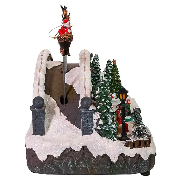 Aldea navideña LED Escena navideña - Multicolor, 28 x 34 x 23 cm - Decoración navideña de pueblo con un Papá Noel giratorio en trineo, árboles nevados y farola cálida.