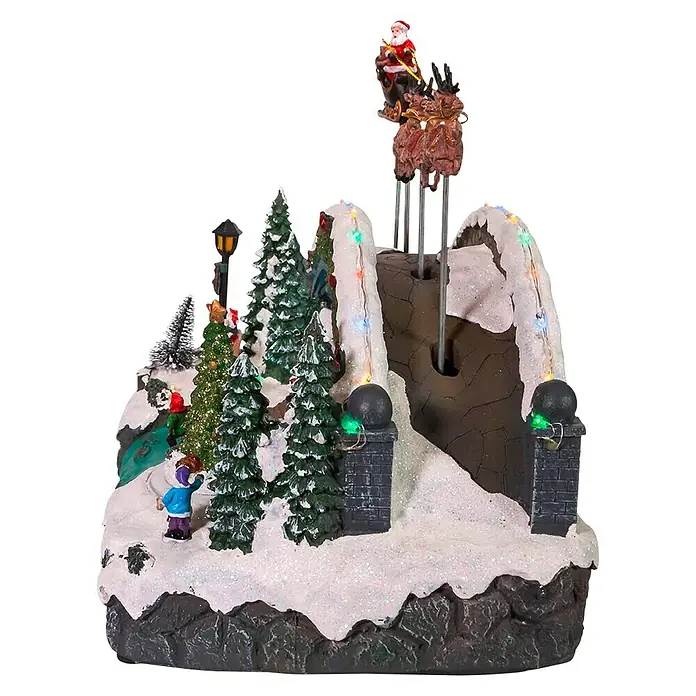 Aldea navideña LED Escena navideña - Multicolor, 28 x 34 x 23 cm - Belén navideño animado con Papá Noel en trineo en una montaña con árboles de Navidad.