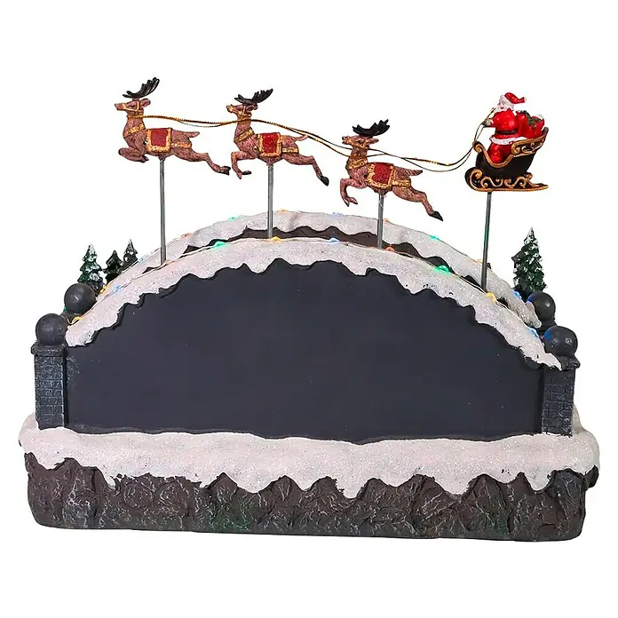 Aldea navideña LED Escena navideña - Multicolor, 28 x 34 x 23 cm - Decoración festiva: Papá Noel en trineo con renos sobre puente nevado con luces.