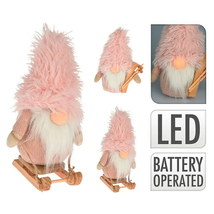 Figura LED navideña Gnomo rosa - 15 x 11 x 23 cm, Rosa - Adorable gnomo rosa con sombrero peludo y esquíes, ideal como decoración festiva. Iluminación LED y funciona con pilas.