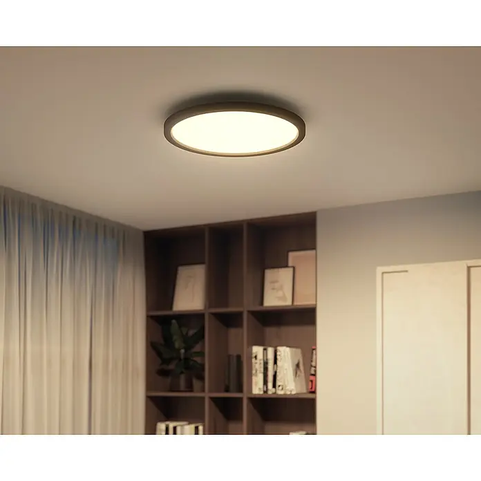 Philips Hue LED-Panel rund Aurelle - 21 W, Ø x H: 39,5 x 4,7 cm, Schwarz, Warmweiß - Modernes Deckenlicht mit kreisförmigem Design. Die Leuchte spendet warmes, einladendes Licht und passt perfekt in moderne Wohnräume.