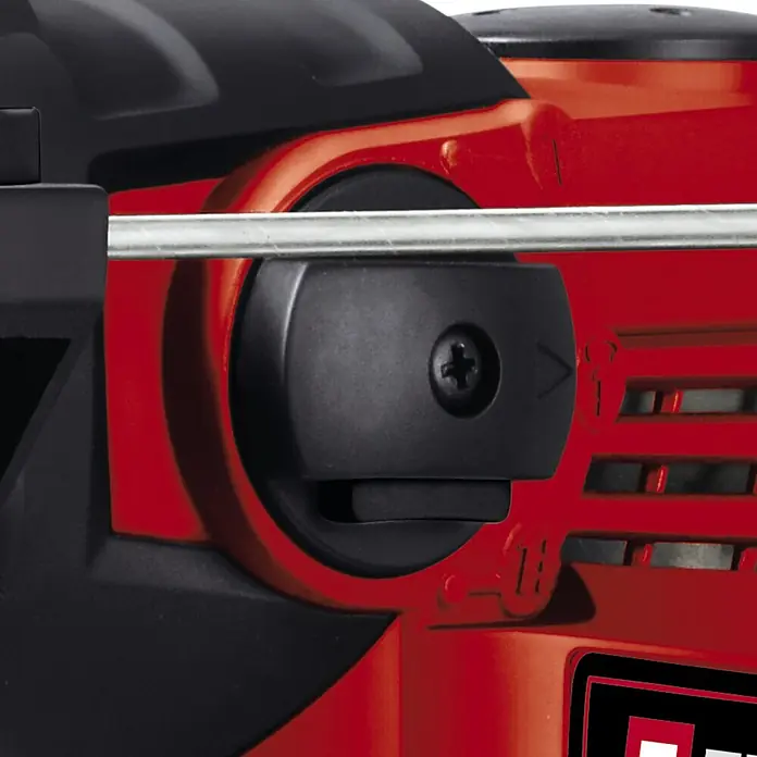 Einhell Kombihammer TC-RH 1600 - 1.600 W, 4 J, SDS-Plus-Aufnahme - Detailaufnahme eines Einhell-Produkts, das ein schwarzes Einstellrad mit einer Schraube auf einer roten Oberfläche zeigt.