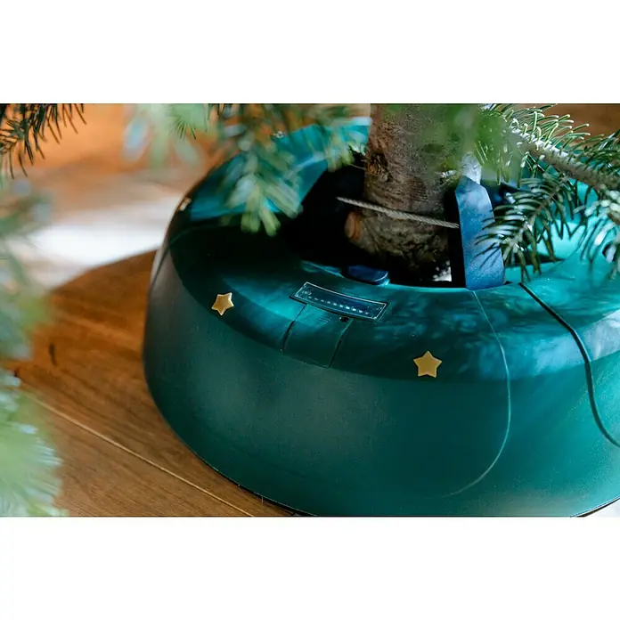 Christbaumständer SELECT 4 - 40 x 10,7 cm, Kunststoff, Rund - Ein grüner Christbaumständer mit goldenen Sternen darauf.