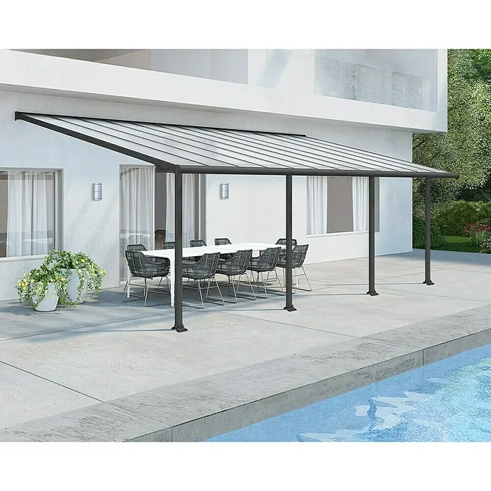 Palram – Canopia Terrassenüberdachung Olympia - B x T: 730 x 300 cm, Anthrazitgrau, Polycarbonat, Transparent - Bild einer modernen Terrassenüberdachung mit klarem Dach und stilvollen Gartenmöbeln für einen gemütlichen Außenbereich.