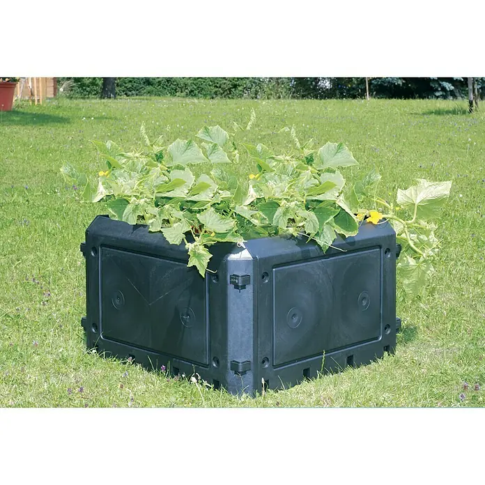 KHW Komposter-Anbauteil Bio-Quick 230KHW Komposter Bio-Quick, L x B x H: 75 x 75 x 45 cm - Das Bild zeigt einen schwarzen, eckigen Hochbeet-Bausatz mit üppigen grünen Pflanzen auf einer grünen Wiese im Freien.