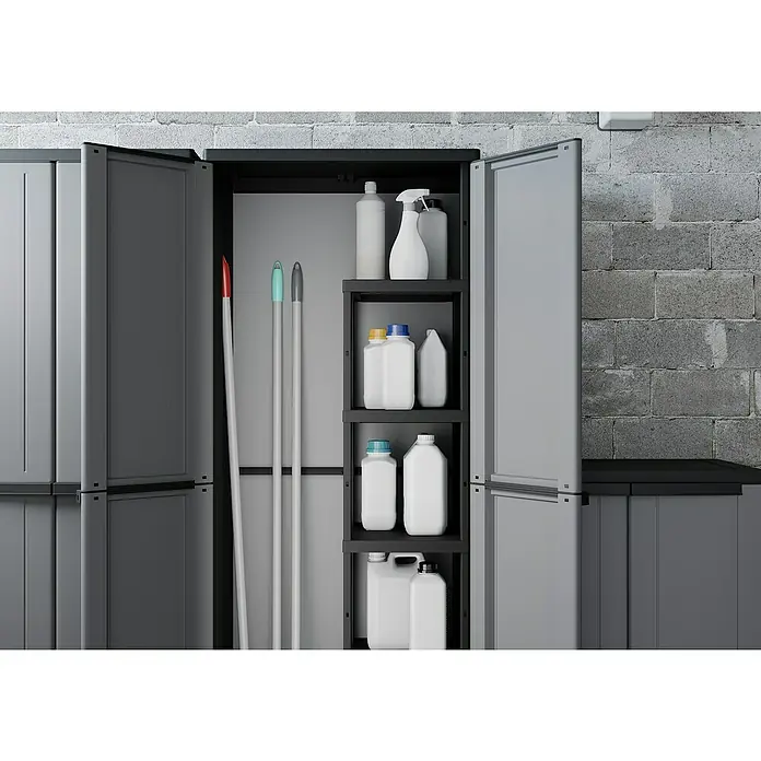 Terry JLine Armario multiusos de plástico  escobero - L x An x Al: 37,5 x 68 x 163,5 cm - Un armario de limpieza gris con puertas abiertas, lleno de artículos y soluciones de limpieza, sobre una pared de piedra gris.