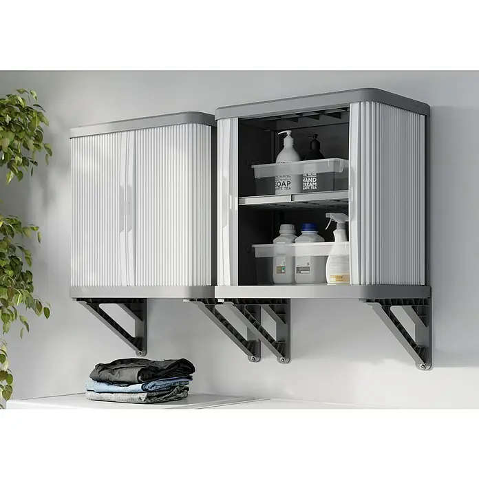 Terry Armario multiusos de plástico  Rolling Space - L x An x Al: 36 x 59 x 59,5 cm - Dos armarios de pared grises con puertas enrollables, montados sobre una pared blanca. Perfecto para lavadero o baño para guardar productos de limpieza.