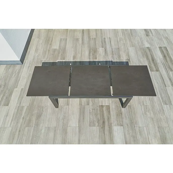 Sunfun Maja Gartentisch Stone - L x B x H: 300 x 100 x 74 cm, Aluminium, Sintered Stone, Ausziehbar, Night-Grey - Draufsicht auf einen ausziehbaren Esstisch mit einer Tischplatte in Steinoptik und einem modernen Metallgestell.