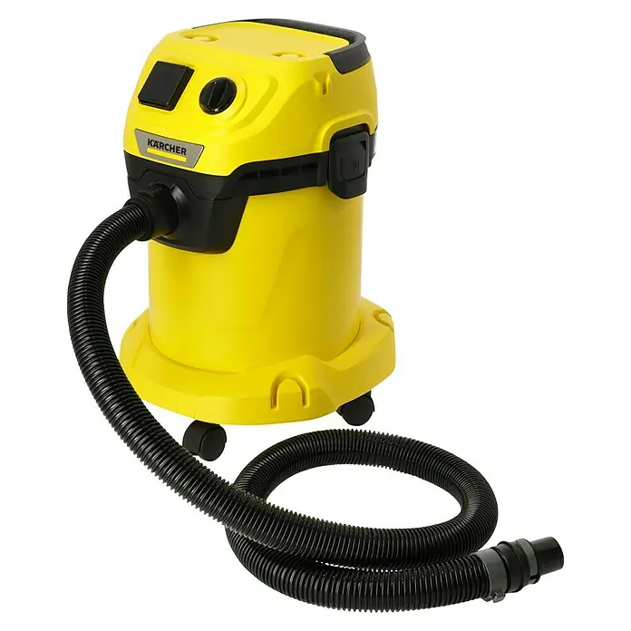 Kärcher Elektro-Nass- & Trockensauger WD 3 P V-17/4/20 Extension - 1.000 W, 17 l, 9 -tlg. - Abbildung eines gelben Kärcher Nass- und Trockensaugers mit schwarzem Schlauch auf schwarzem Hintergrund.