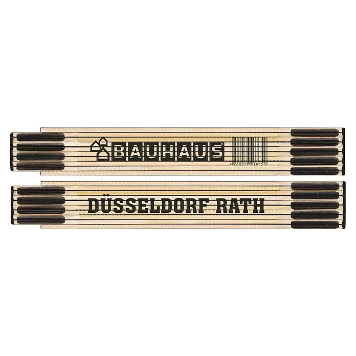 BAUHAUS Zollstock - Düsseldorf Rath - Holz-Zollstock mit schwarzen Markierungen, BAUHAUS-Logo, Barcode und "DÜSSELDORF RATH" Schriftzug.
