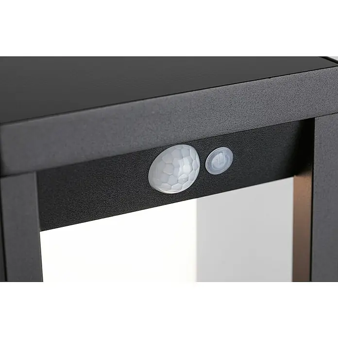 Paulmann Solar-Außenwandleuchte Marisol - Max. Systemleistung: 5,5 W, L x B x H: 18 x 15 x 27 cm, Schwarz, Lichtstrom: 350 lm - Nahaufnahme einer schwarzen Außenleuchte mit Bewegungssensor und Schalter für eine intelligente Beleuchtung im Außenbereich.