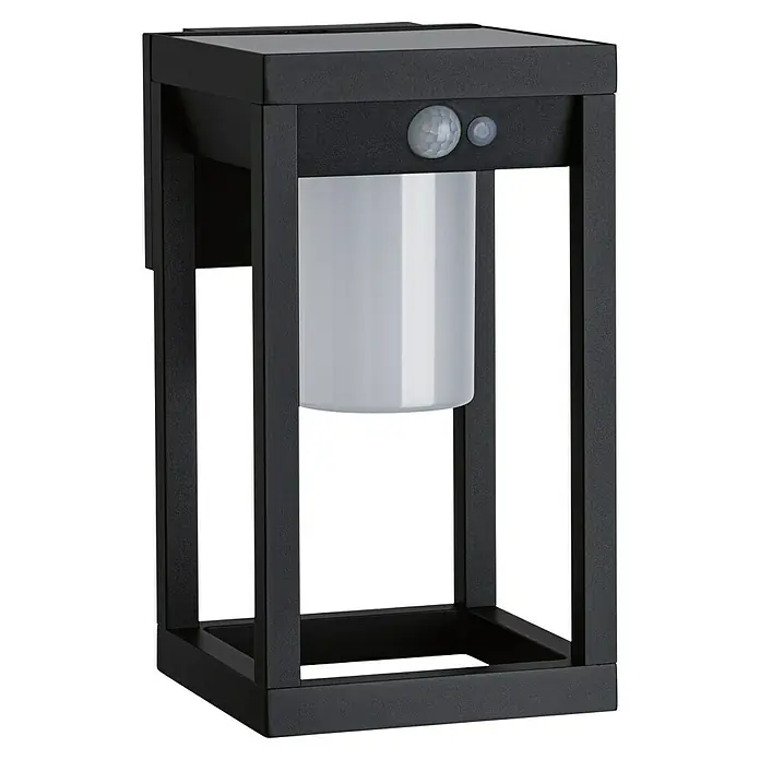 Paulmann Solar-Außenwandleuchte Marisol - Max. Systemleistung: 5,5 W, L x B x H: 18 x 15 x 27 cm, Schwarz, Lichtstrom: 350 lm - Nahaufnahme einer schwarzen Außenleuchte mit Bewegungsmelder und zylindrischem Lampenschirm für stimmungsvolle Beleuchtung.