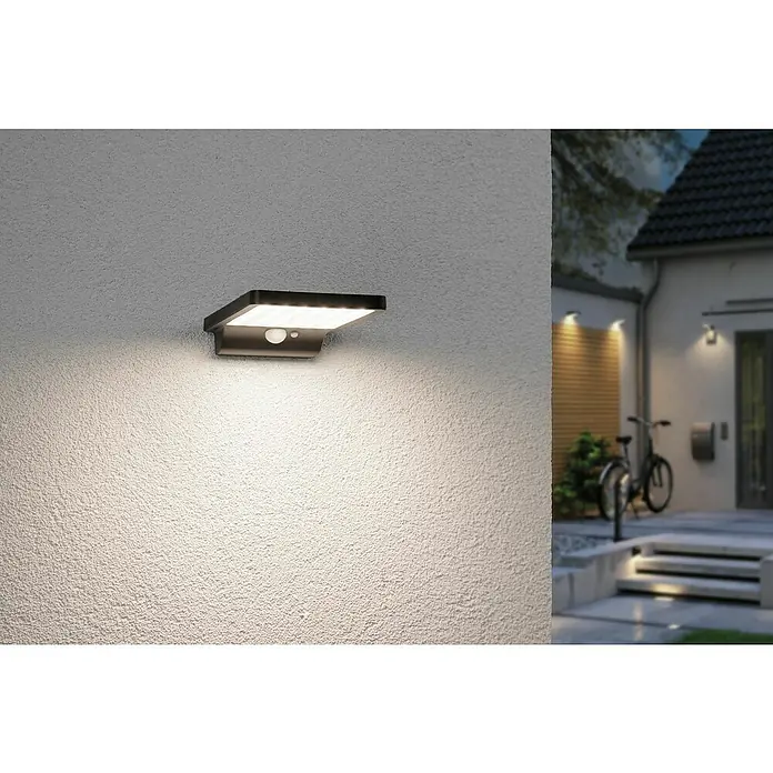 Paulmann Solar-Außenwandleuchte Solveig - Max. Systemleistung: 4,8 W, L x B x H: 17,3 x 10,5 x 2,9 cm, Schwarz, Lichtstrom: 338 lm - Eine moderne Außenwandleuchte mit Bewegungsmelder beleuchtet eine strukturierte Wand und sorgt für Sicherheit und Komfort im Außenbereich.