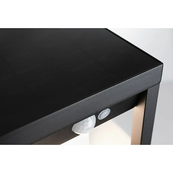 Paulmann Solar-Außenwandleuchte Marisol - Max. Systemleistung: 5,5 W, L x B x H: 18 x 15 x 27 cm, Schwarz, Lichtstrom: 350 lm - Nahaufnahme einer schwarzen Solarleuchte mit Bewegungssensor, die modernes Design und umweltfreundliche Technologie vereint.