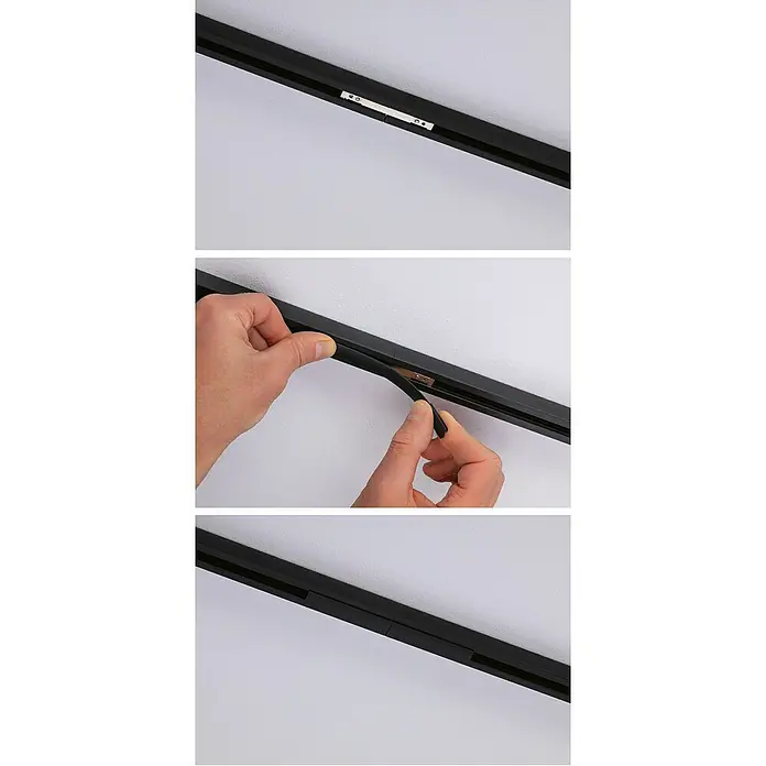 Paulmann URail Abdeckung Connector-Inlay - Schwarz/Transparent - Detailaufnahme einer schwarzen Stromschienenschiene, die an einer weißen Decke befestigt ist und mit einer schwarzen Abdeckung versehen wird.